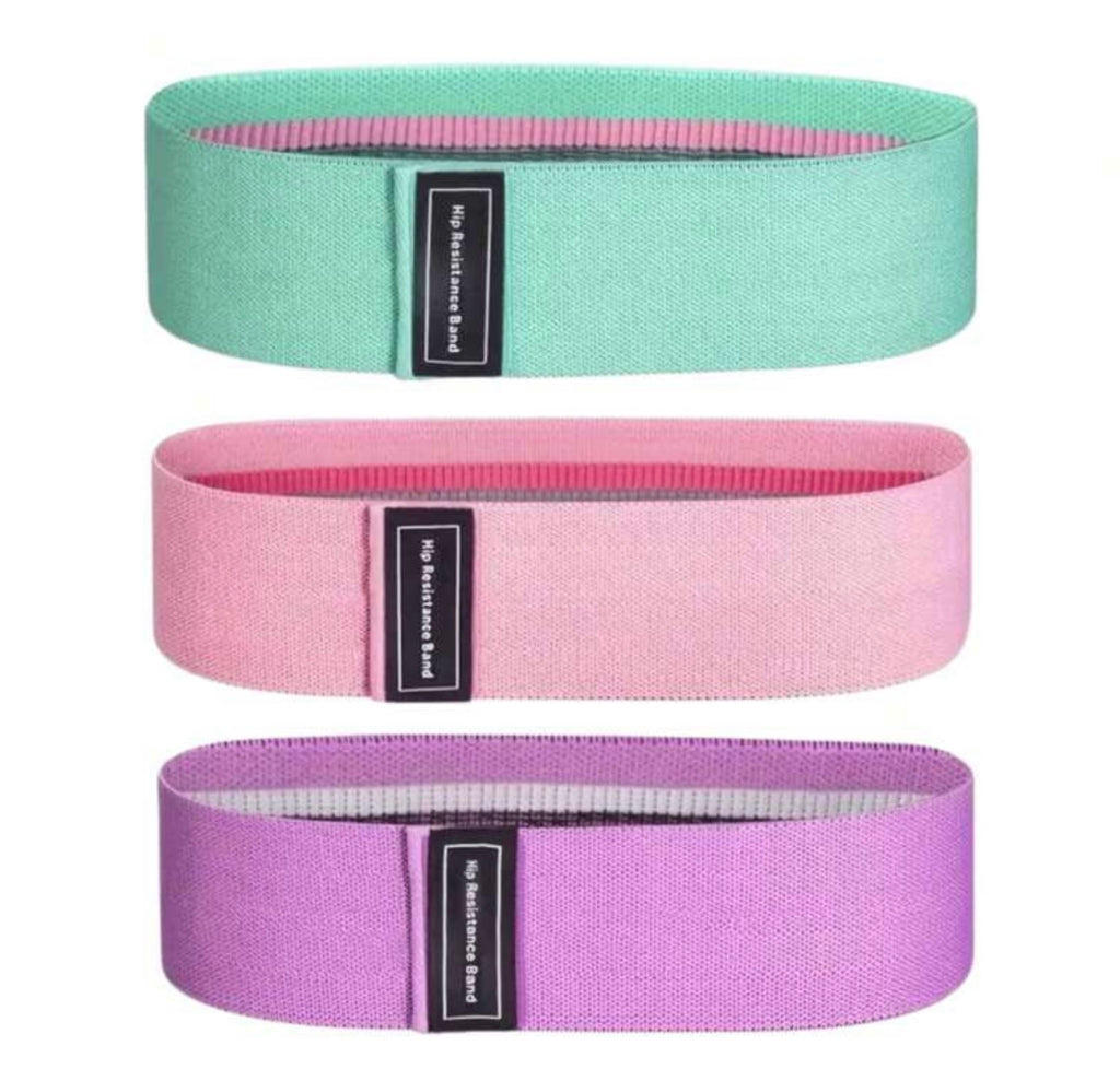 fabric resistance bands set in three colors: green, pink, and purple for effective workouts and resistance training.